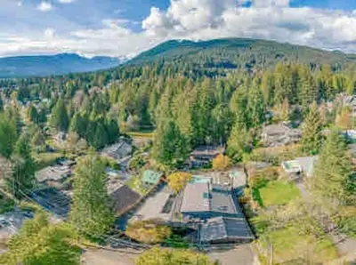 an aerial view of a house in the middle of a forest at The Lions Self Contained Suite, Shared Pool, Hot Tub, Views in North Vancouver