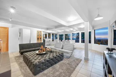 a living room with a couch and a table at Cypress: Private Bedroom/Bathroom/Office, with Shared Pool, Hot tub in North Vancouver