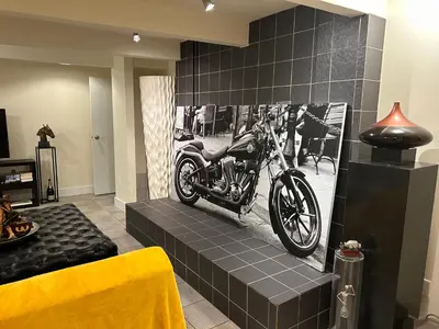 a motorcycle on a wall in a living room at Cypress: Private Bedroom/Bathroom/Office, with Shared Pool, Hot tub in North Vancouver