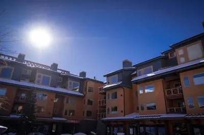a row of buildings with the sun in the sky at Wanna get away in the Rocky Mountains in Canmore