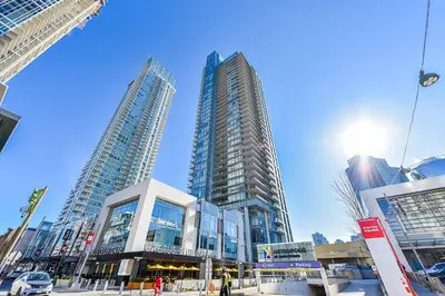 a group of tall buildings in a city at Burnaby Metrotown Cozy 3 Bedroom Suite Walk to Skytrain and Malls in Burnaby