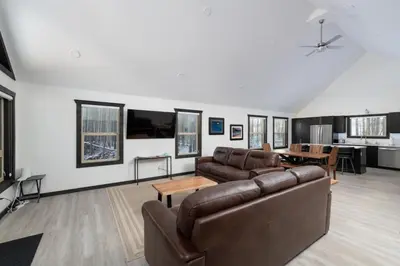 a living room with a couch and a table at The Sundance Cabin in Valemount